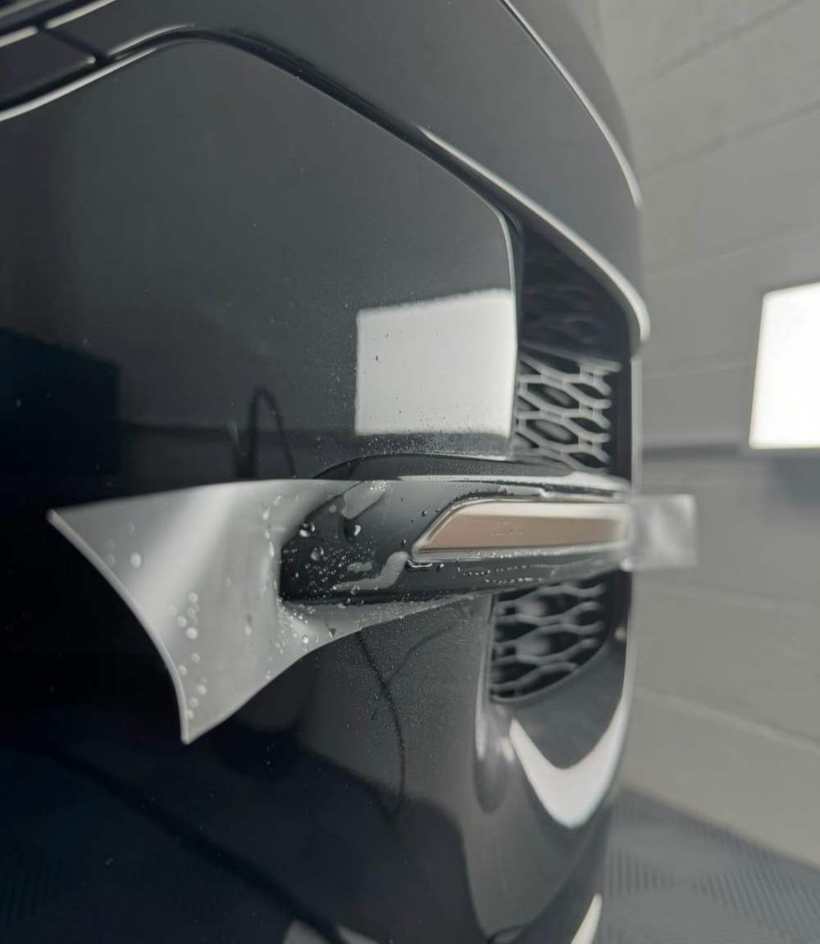 Close-up of a wrapped door handle recess