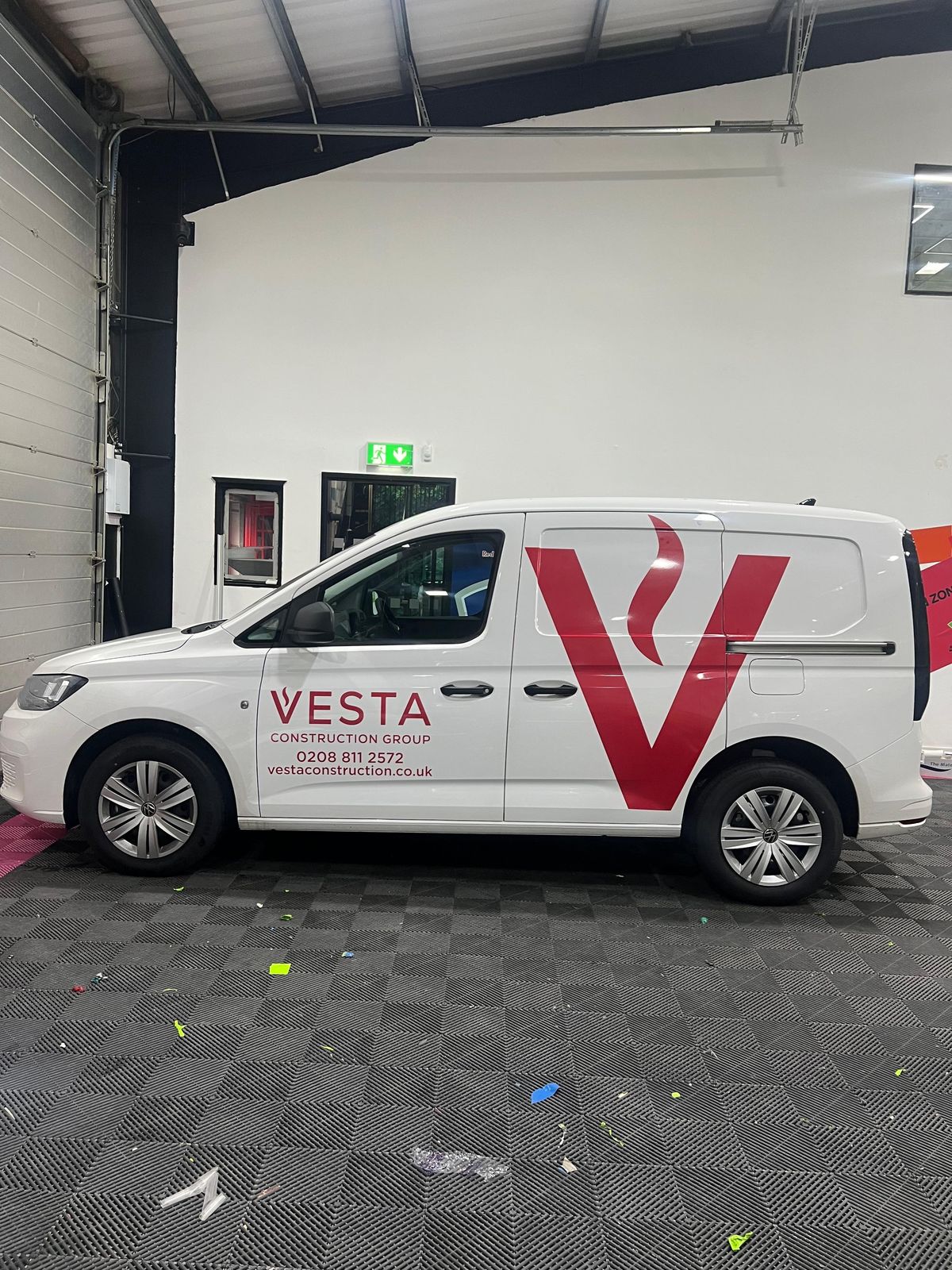Vesta Construction Group VW Caddy sign writing